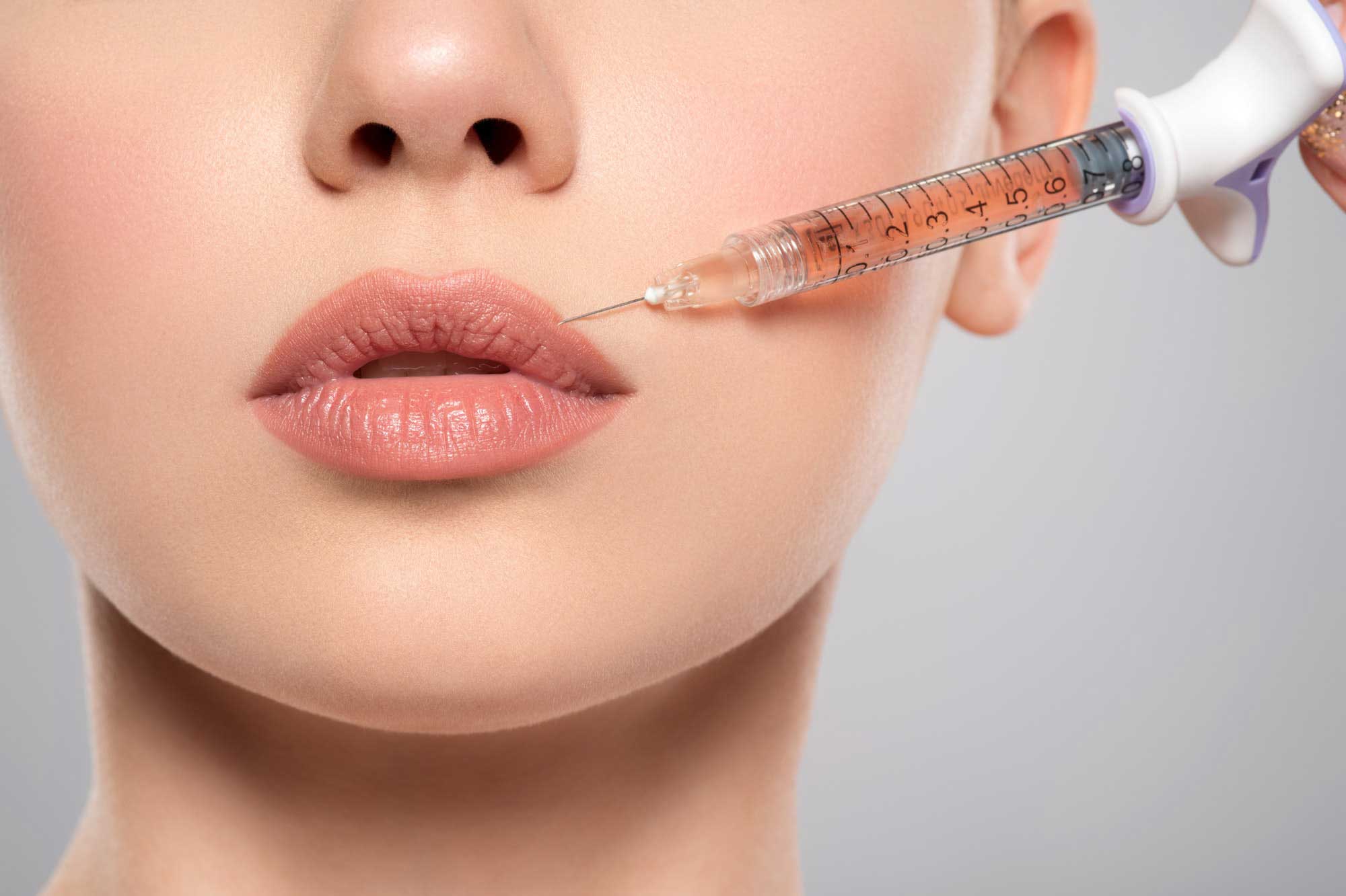 woman-getting-cosmetic-injection-of-botox-in-lips-closeup-.jpg